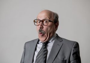 man gesturing funny and comic in laughter