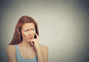 skeptical suspicious young woman