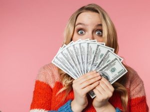woman holding a lot of cash
