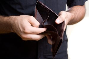 Man showing an empty wallet